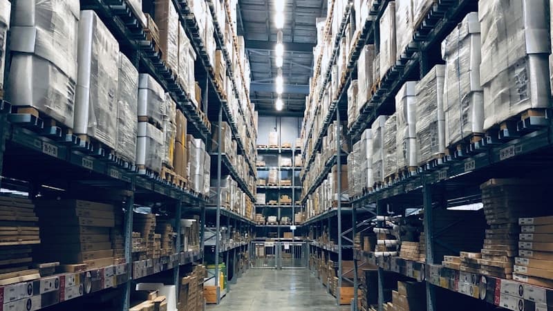 Small warehouse shelf with packed orders ready for thermal label printing